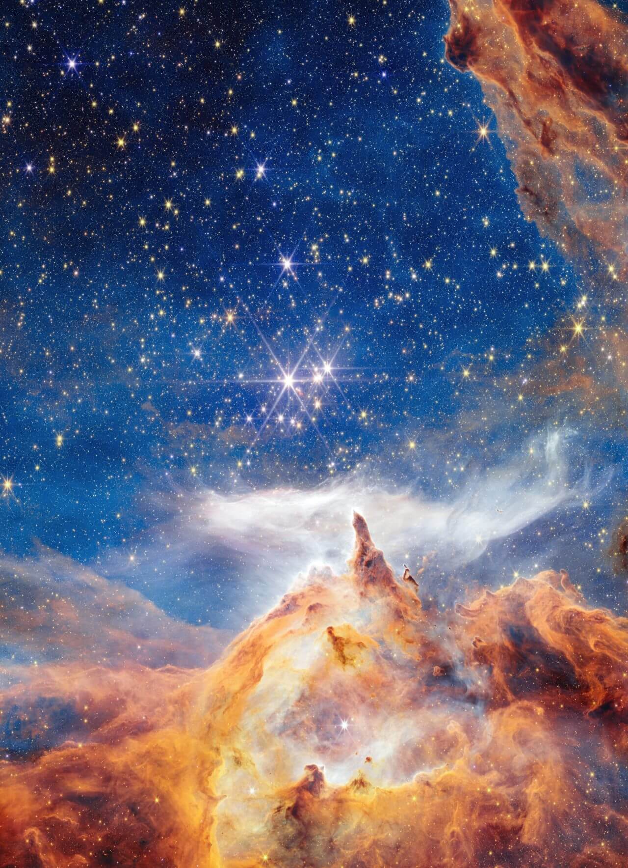 まばゆく輝く巨大な若き星々 ジェームズ・ウェッブ宇宙望遠鏡が観測した散開星団「ピスミス24」