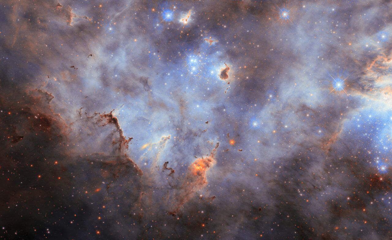 若き星々が照らす幻想的な光景 ハッブル宇宙望遠鏡が観測した星形成領域「N11」